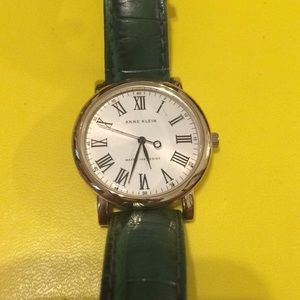Ann Klein gold watch with green band